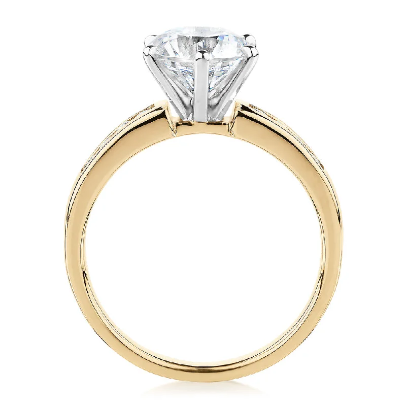 Round Brilliant shouldered engagement ring with 2.2 carats* of diamond simulants in 14 carat yellow and white gold